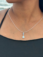 Load image into Gallery viewer, Silver body chain with a pendant on a person wearing a black top.