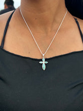 Load image into Gallery viewer, Larimar Necklace with a cross pendant worn by a person in a black top

